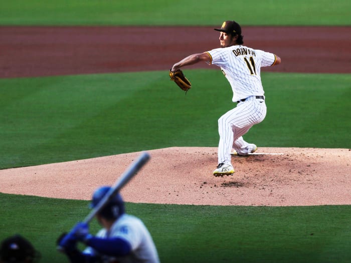 San Diego Padres starting pitcher Yu Darvish winds up before throwing to a Los Angeles Dodgers batter during the first inning of a baseball game Saturday, April 23, 2022, in San Diego.